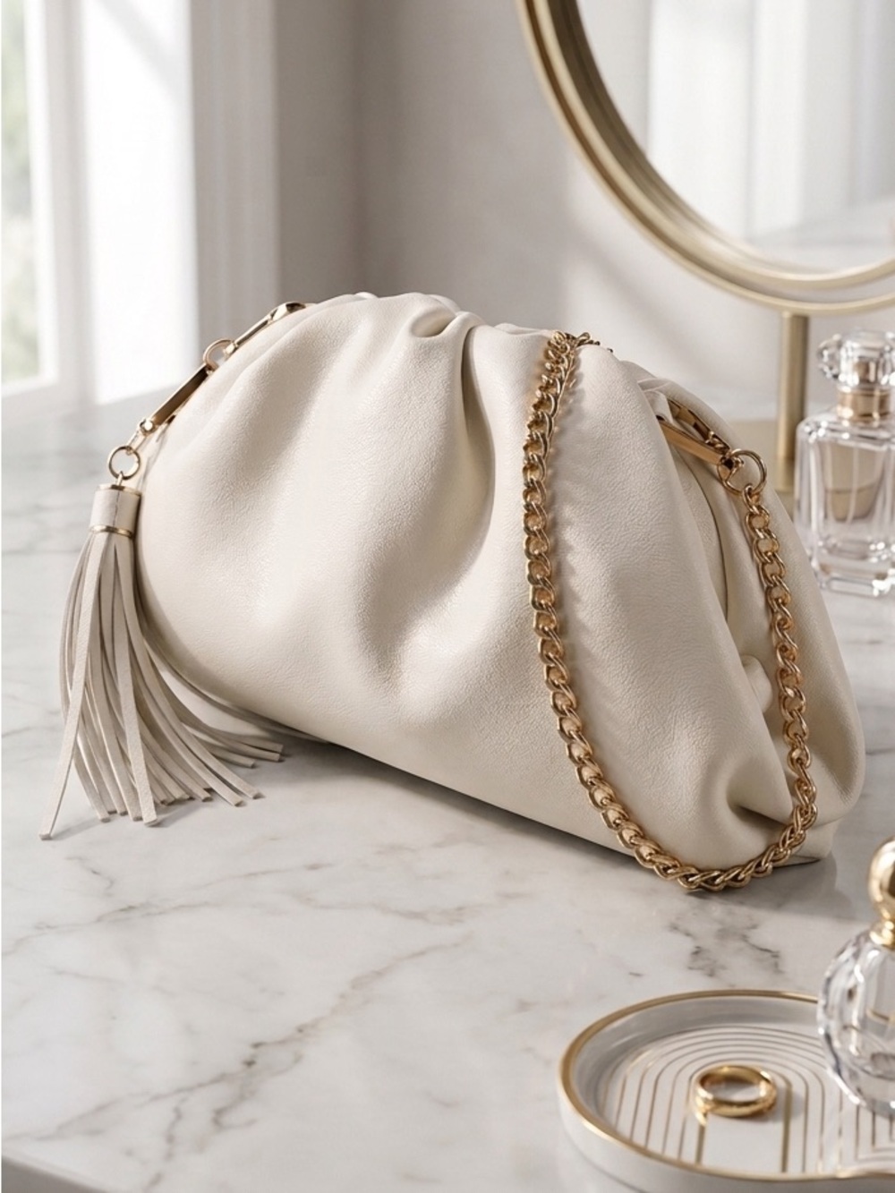 Understated Leather Crescent Clutch in Cream Vegan Leather